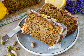 Pistachio, cardamom and lemon drizzle cake