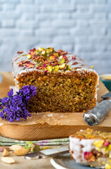 Pistachio, cardamom and lemon drizzle cake