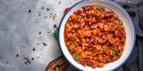 Сhili con carne bean, corn, meat, tomato sauce healthy meal food snack on the table copy space food background 