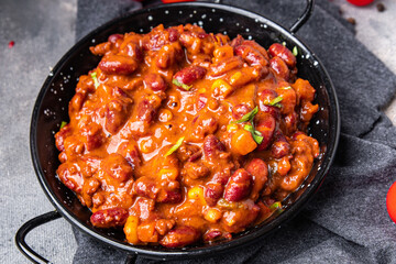 Сhili con carne bean, corn, meat, tomato sauce healthy meal food snack on the table copy space food background 