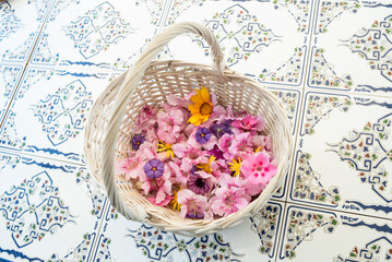 Fototapeta na wymiar Large variety of flowers in a wicker basket
