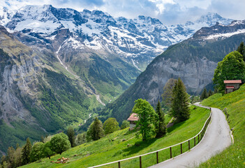 Landscape of Lauterbrunnen valley in Swiss Alps, Switzerland. Hiking trail from Murren to Gimmelwald.