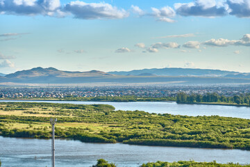 Ulan-Ude, Russia - July 20, 2022: Panoramic view from the height of the city in summer on a bright sunny day.