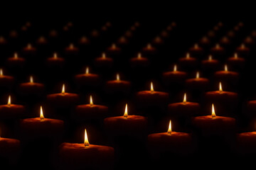 The light of a candle illuminate the darkness.
