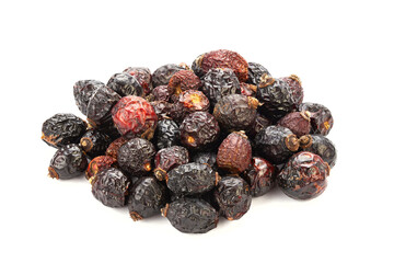 Heap of red dry rose hips isolated on a white background.