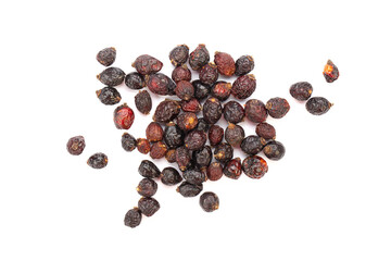 Heap of red dry rose hips isolated on a white background.