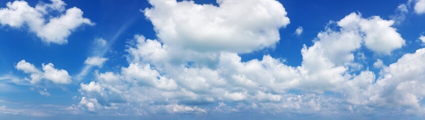 White cumulus clouds on clear blue sky background panorama, beautiful cloudscape wide panoramic view, cloudy skies backdrop, fluffy cloud texture, sunny summer day heaven landscape, cloudiness weather