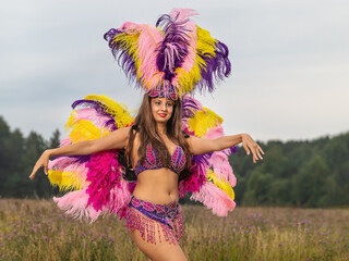 Young woman in carnival costume outdoors