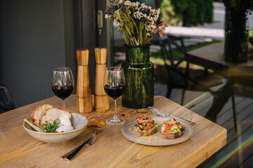 Italian salad with Burrata cheese and tomatoes and bruschetta with pesto sauce