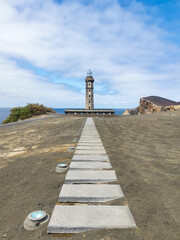 lighthouse on the shore of the sea