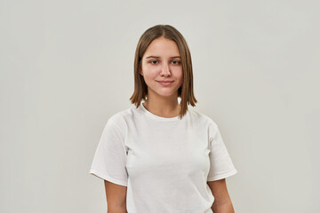 Fototapeta premium Portrait of smiling caucasian girl look at camera