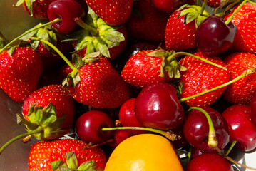 Obraz na płótnie Canvas Ripe tasty berries apricot, sweet cherry, strawberry close up. Top view