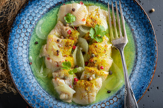 Tasty pickled fish with pepper and onion.