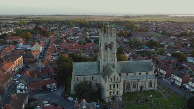 Drone filmed at sunset. St Augustine's Church. Church of England parish church located in Hedon, East Riding of Yorkshire. 