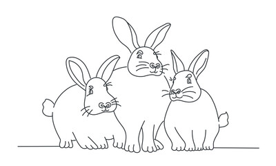 Three Rabbits are sitting together.