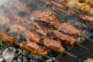 Cooking kebabs on skewers, closeup photo