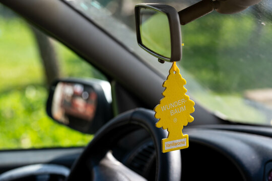 Miercurea Ciuc, Romania- 09 October 2022: Hanging Wunder Baum Vanillaroma car freshener on car interior.