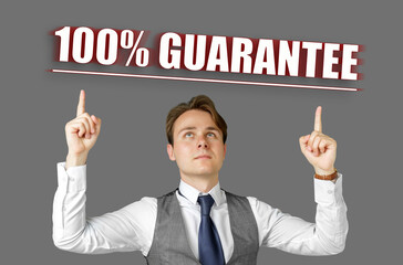 Businessman points fingers at the inscription - 100 percent guarantee