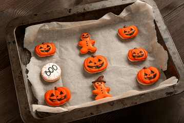 Ghosts and pumpkin gingerbread. Cookies for Halloween lie in form for baking. Top view. Delicious sweets