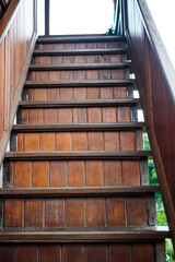 Close-up photo of natural wood stairs outdoors