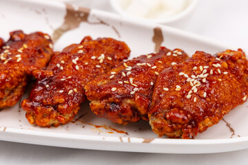 Korean fried chicken in spicy sauce ,  spicy sauce in Korean style