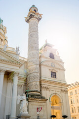 Front view of Saint Karl Cathedral in Vienna at Autumn colors, Austria, at direct front sunlight and lend flare, sunny day