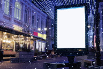 Blank white mock up vertical billboard street poster on a Christmas illumination city background
