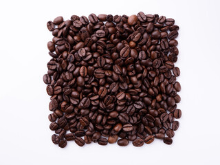 Coffee beans in the form of a square on a light background