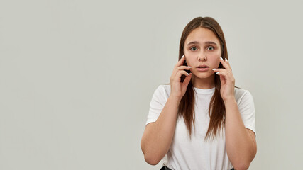 Tense caucasian female teenage looking at camera