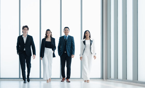 Group business people in formal wear walking standing discussion and proud on success in modern office
