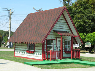 Concept of smal tiny house wooden with red roof