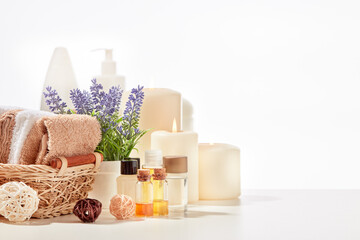 Spa background. Cosmetic creams, natural oils, towels on white background with copy space. Healthy lifestyle, spa, body care
