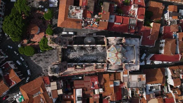 Aerial view above the Church of Santa Prisca de Taxco, in sunny Mexico - top down, drone shot
