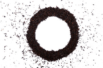Dry black tea leaves round frame and border pile isolated on white background