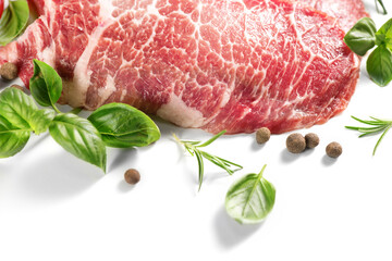 Raw meat isolated on white background. Prime fillet meat. Marble beef steak Black Angus Steak Rib eye with Herbs and Spices.