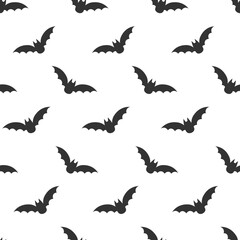 Seamless Halloween pattern: silhouette of bats in the sky. Flat style vector image.