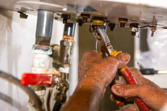 An electrician installs a new outlet. Using a flyer