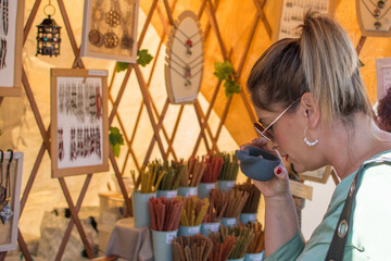 Woman In The Market.
Mature woman in the stalls of a street market on a street choosing and...