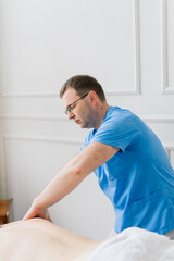 Obraz premium Anti-cellulite foot massage for a fat woman. Concept of personal care, weight loss, diet. Close-up.