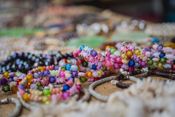 Many colorful bracelets from handcraft souvenirs shop