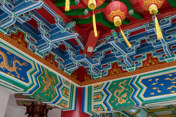 Red lanterns and contrasting painting in the Kek lok si temple in Malaysia. This temple is one of the largest in south-east asia

