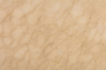 Crema Marfil Marble background, texture in beige color for stylish design. Slab photo. Glossy pattern for exterior home decoration, floor tiles, 3d ceramic, wall tiles. Pattern for exterior projects.