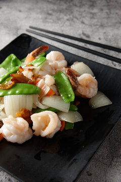 Cooked prawns and vegetables on plate