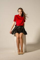 Portrait of young beautiful girl. Photo-shoot executed in the studio.