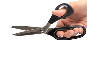 Tailor's scissors in a female hand on a white background. Close-up. Isolated
