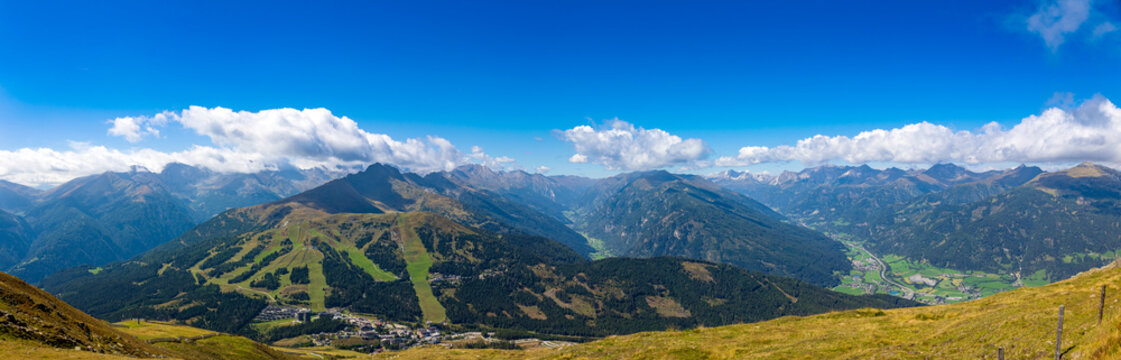 Large panoramic photo with view for the Austrian Alps between Carinthia and Salzburg Land. View from the summit above the cloud line into the valleys. 