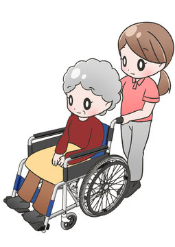 おばあさんを乗せた車椅子を押す女性