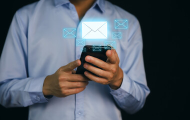 Businessman holding mail icon. Electronic mail concept, online communication on the internet network	
