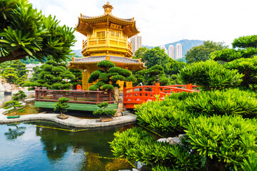 Oriental gold pavilion green tree and pond in Nan Lian garden