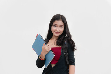 A studio portrait of a Filipina college student bringing her notes that are placed in a folder. Isolated on a white background.